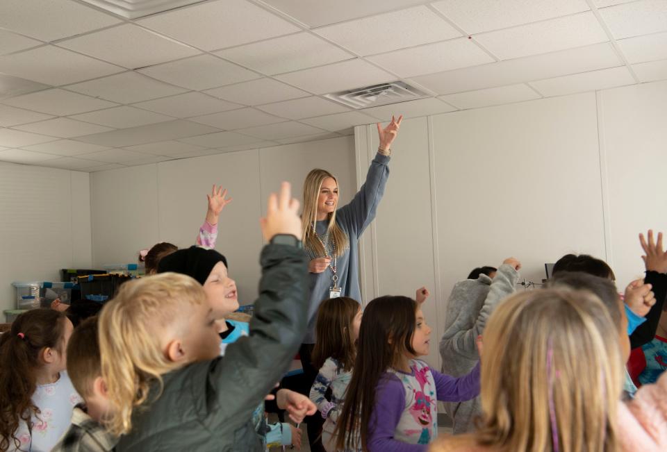 Makena Hertel leads her class at West Wilson Middle School through an exercise on Nov. 14, 2022.