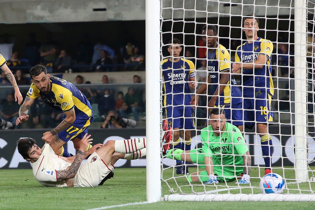 Sandro Tonal, bottom left, scores AC Milan’s equaliser in their 3-1 win at Verona (Paola Garbuio/AP) (AP)