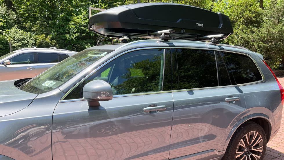 a rooftop cargo pod that good housekeeping mounted to a vehicle