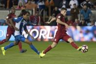 March 24, 2017; San Jose, CA, USA; United States midfielder Christian Pulisic (10) kicks the ball against Honduras defender Henry Figueroa (4) during the first half of the Men's World Cup Soccer Qualifier at Avaya Stadium. Mandatory Credit: Kyle Terada-USA TODAY Sports