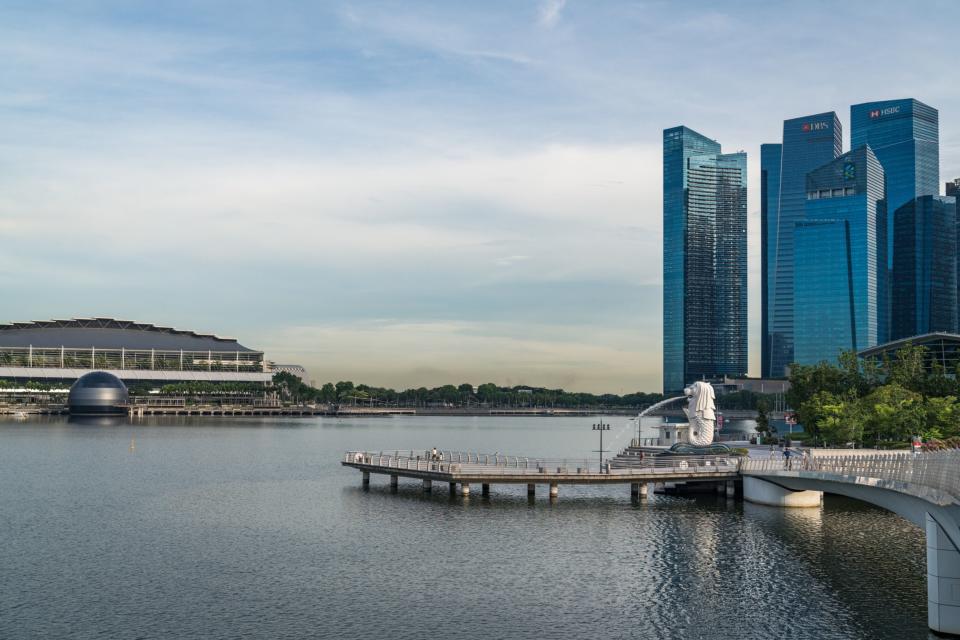 The Merlion Statue and Jubilee Bridge stand in front of the city skyline during the 