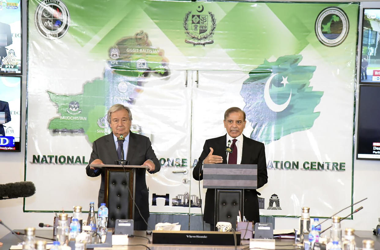 In this handout photo released by Pakistan Prime Minister Office, Prime Minister Shahbaz Sharif, right, speaks during a joint press conference with U.N. Secretary-General Antonio Guterres at the Prime Minister House in Islamabad, Pakistan, Friday, Sept. 9, 2022. Guterres appealed to the world for help for cash-strapped Pakistan after arriving in the country Friday to see the climate-induced devastation from months of deadly record floods. (Pakistan Prime Minister Office via AP)