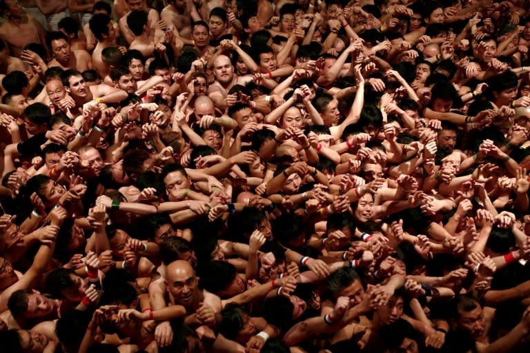 Around 10,000 hardy souls formed a writhing mass of sweaty worshippers inside Saidaiji Temple in Okayama, western Japan for the Naked Man Festival