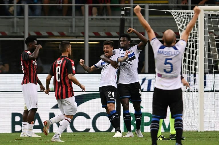 Emiliano Rigoni snatched a point as Atalanta came from behind twice to hold AC Milan 2-2 at the San Siro