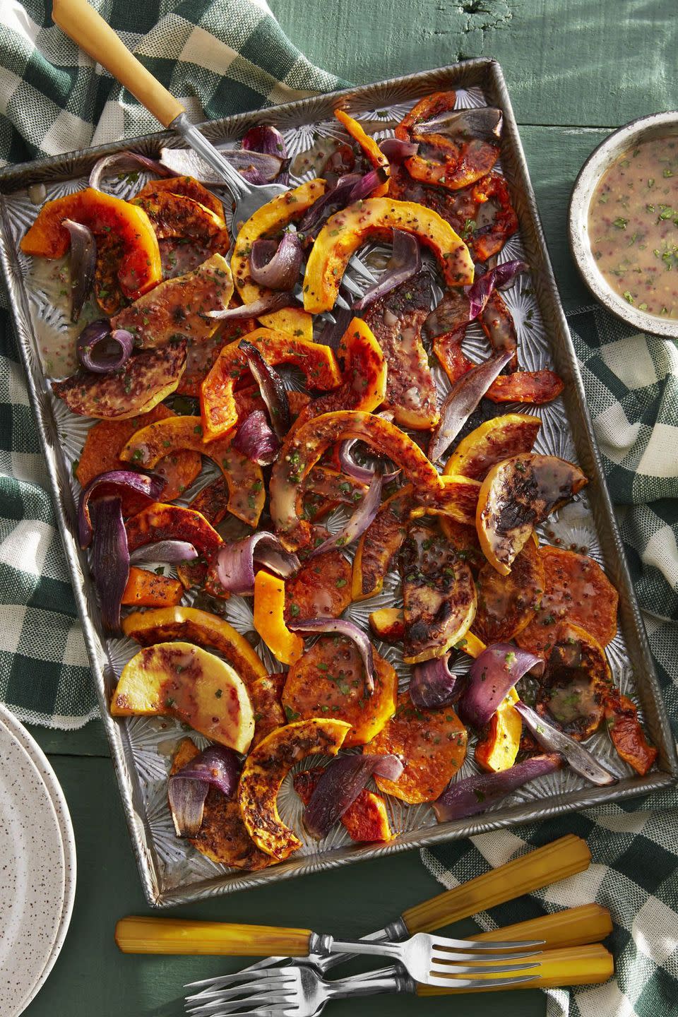 <p>Although we love sweet <a href="https://www.countryliving.com/food-drinks/a23367748/roasted-butternut-squash-with-cider-vinaigrette-recipe/" rel="nofollow noopener" target="_blank" data-ylk="slk:apple cider recipes;elm:context_link;itc:0;sec:content-canvas" class="link ">apple cider recipes</a>, this savory take is one of our favorites. The <a href="https://www.countryliving.com/food-drinks/g2701/butternut-squash-recipes/" rel="nofollow noopener" target="_blank" data-ylk="slk:butternut squash;elm:context_link;itc:0;sec:content-canvas" class="link ">butternut squash</a> gets plenty of savory notes thanks to whole-grain mustard, red wine vinegar, and fresh parsley.</p><p><strong><a href="https://www.countryliving.com/food-drinks/a23367748/roasted-butternut-squash-with-cider-vinaigrette-recipe/" rel="nofollow noopener" target="_blank" data-ylk="slk:Get the recipe;elm:context_link;itc:0;sec:content-canvas" class="link ">Get the recipe</a>.</strong></p><p><strong><a class="link " href="https://www.amazon.com/Nordic-Ware-Natural-Aluminum-Commercial/dp/B0049C2S32/?tag=syn-yahoo-20&ascsubtag=%5Bartid%7C10050.g.33370793%5Bsrc%7Cyahoo-us" rel="nofollow noopener" target="_blank" data-ylk="slk:SHOP BAKING SHEETS;elm:context_link;itc:0;sec:content-canvas">SHOP BAKING SHEETS</a></strong><strong><br></strong></p>