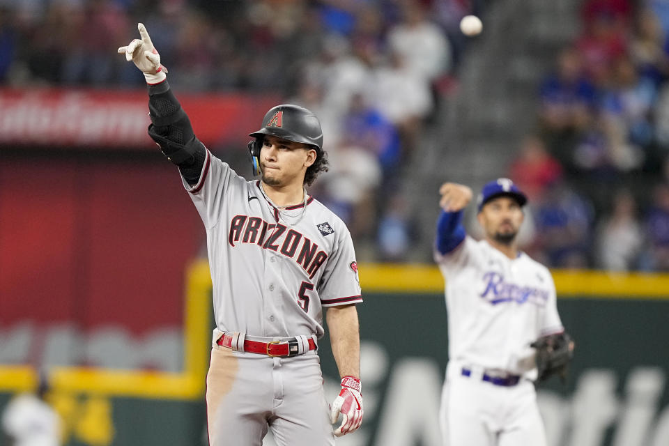 Arizona Diamondbacks' Alek Thomas celebrates after a double against the Texas Rangers during the seventh inning in Game 2 of the baseball World Series Saturday, Oct. 28, 2023, in Arlington, Texas. (AP Photo/Brynn Anderson)