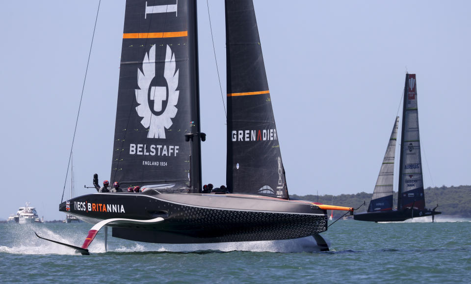 Ineos Team UK, left, leads American Magic during the Prada Cup challengers series on Auckland's Waitemate Harbour, New Zealand, Friday, Jan. 15, 2021. The winner of the five week long Challenger Series goes on to challenge defenders Team New Zealand for the America's Cup from March 6 to 15. (Brett Phibbs/NZ Herald via AP)