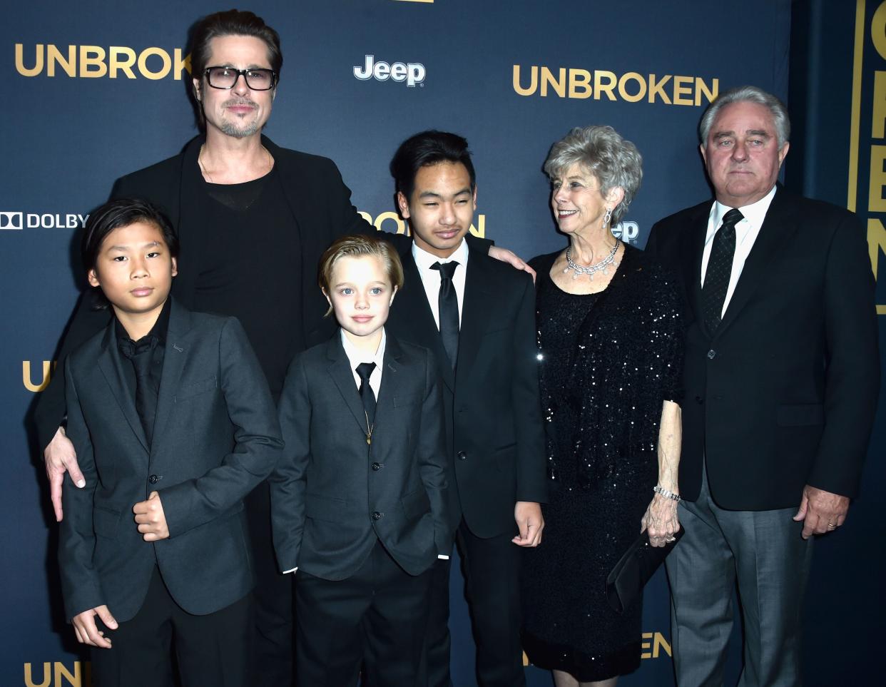 Brad pitt with his children at movie premiere 