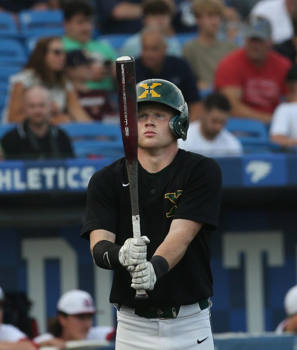 St. X’s Cooper Smith checks his bat before he hits against Russell County.June 11, 2022