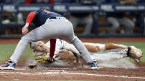 Boston Red Sox pitcher Matt Strahm tags out Tampa Bay Rays' Taylor Walls as he tries to score from second base on a wild pitch during the seventh inning of a baseball game Wednesday, Sept. 7, 2022, in St. Petersburg, Fla. (AP Photo/Chris O'Meara)