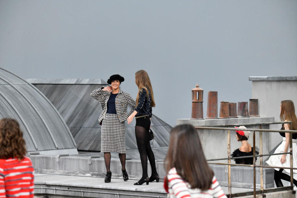 PARIS, FRANCE - OCTOBER 01: Gigi Hadid approaches the woman during the finale and escorted her off the catwalk, because few minutes before a spectator inserted herself among the lineup of models during the finale, identified as Marie Benoliele, best known as Marie S'Infiltre a youtuber, during the Chanel Ready to Wear Spring/Summer 2020 fashion show as part of Paris Fashion Week on October 01, 2019 in Paris, France. (Photo by Victor VIRGILE/Gamma-Rapho via Getty Images)