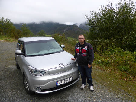 Heiko Hauschulz poses next to his electric car in a remote village in Hjelmeland, Norway September 7, 2017. REUTERS/Alister Doyle