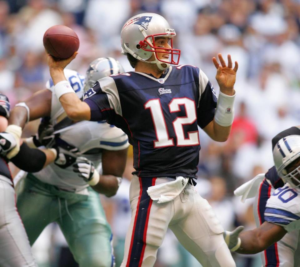 Tom Brady looks to throw the ball against the Cowboys in the Patriots in the Patriots win over the Cowboys 48 - 27. The Dallas Cowboys play the New England Patriots at Stadium in Irving Sunday, October 14, 2007.