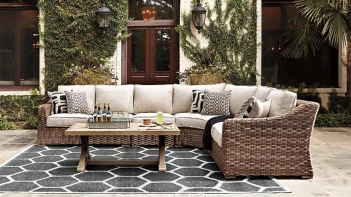 Pick up a comfortable outdoor sectional on sale at Ashley Furniture for all your summer gatherings.