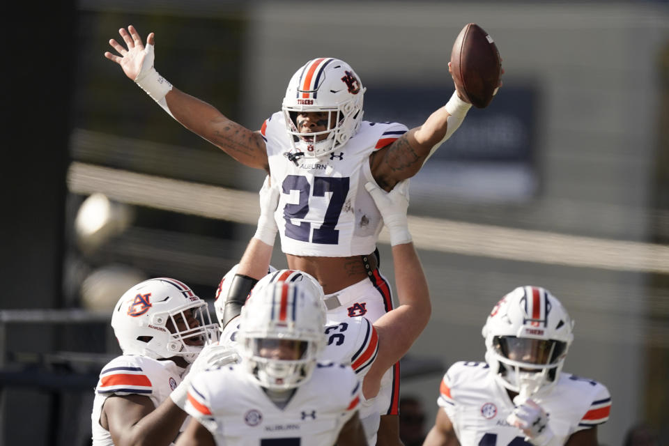 Auburn running back Jarquez Hunter (27) celebrates a touchdown against Vanderbilt in the first half of an NCAA college football game Saturday, Nov. 4, 2023, in Nashville, Tenn. (AP Photo/George Walker IV)