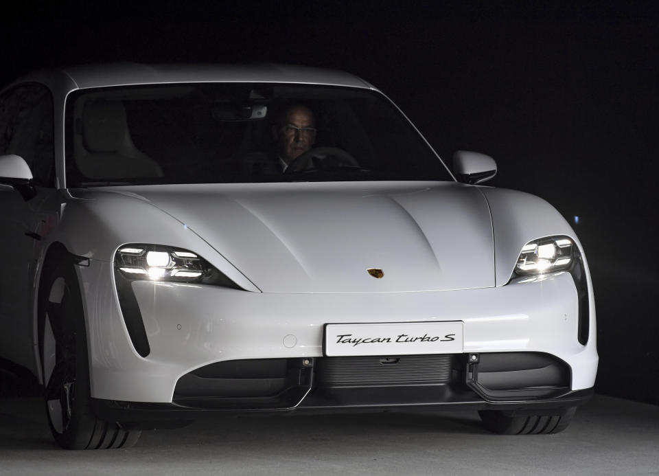 The Porsche Taycan, the first purely electric driven car of the German car maker, is present during a world premier event at the airport Neuhardenberg, about 70 kilometers (45 miles) east of Berlin, Wednesday, Sept. 4, 2019. (Patrick Pleul/dpa via AP)