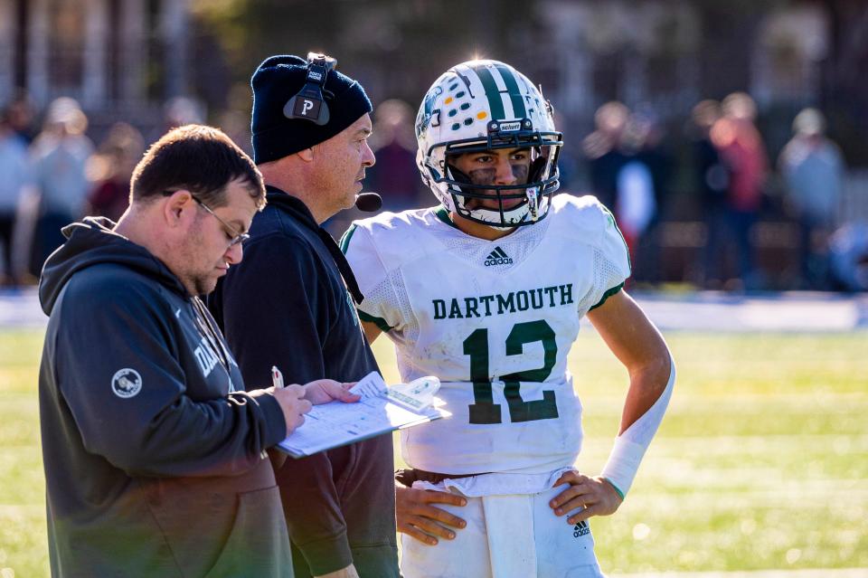 Dartmouth coach Richard White gives the play to Jackson Hart.