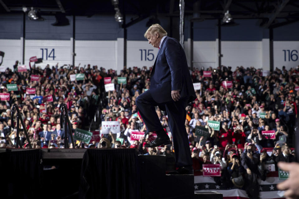 President Donald Trump arrives at W.K. Kellogg Airport to attend a campaign rally, Wednesday, Dec. 18, 2019, in Battle Creek, Mich., on the same day the House of Representatives voted to impeach him. (AP Photo/ Evan Vucci)