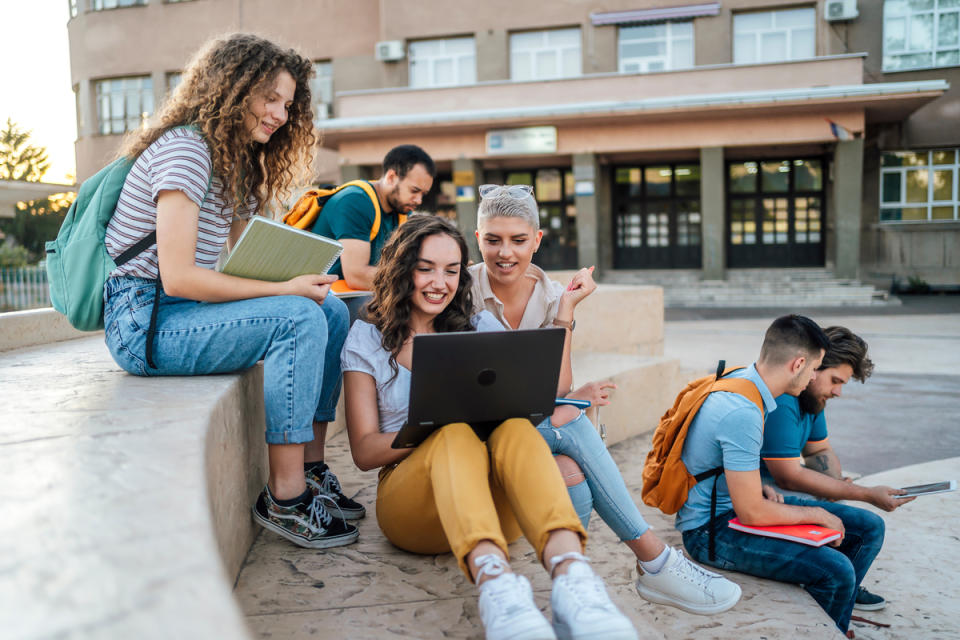 Students looking at a computer