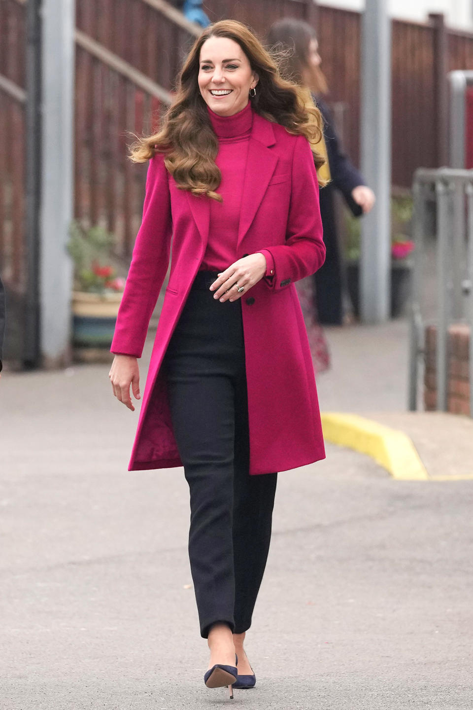 <p>Kate Middleton is a bright spot on Nov. 24 as she arrives for a visit to Nower Hill High School in London.</p>