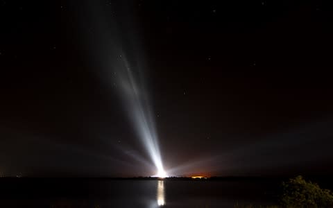 the United Launch Alliance Delta IV Heavy rocket with the Parker Solar Probe is illuminated ahead of launch - Credit: Nasa