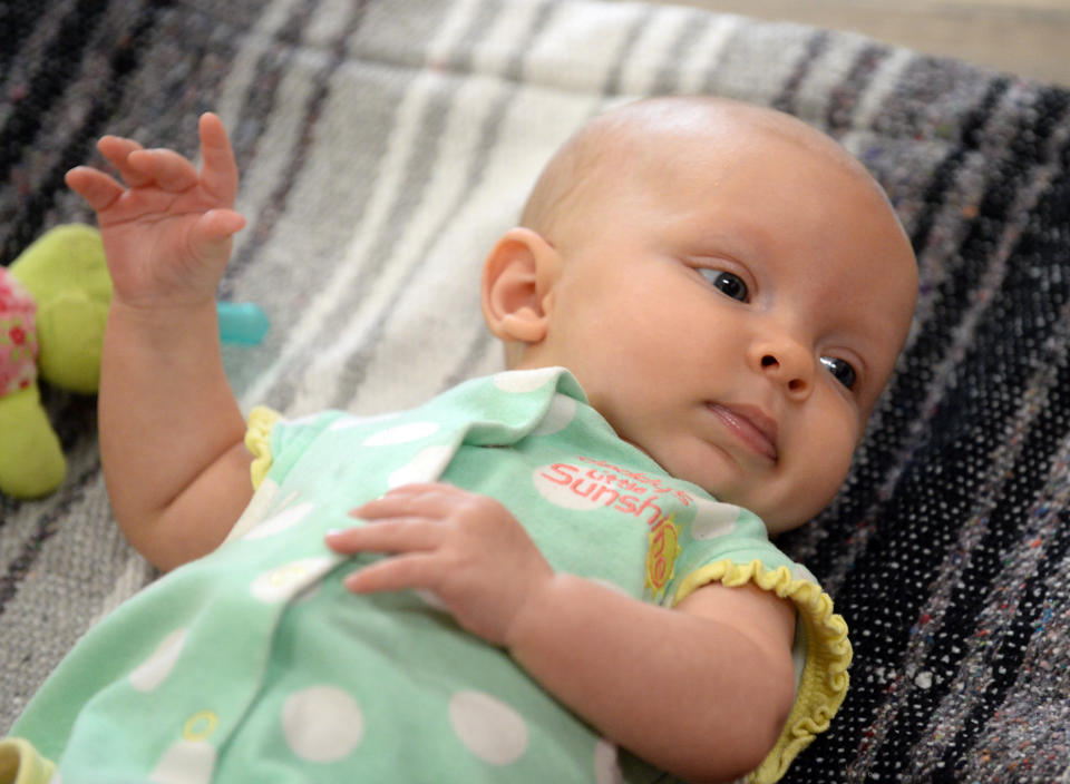 Freya Thorsted, 4-months, relaxes before the baby yoga class. .(Photo by Cliff Grassmick/Digital First Media/Boulder Daily Camera via Getty Images)