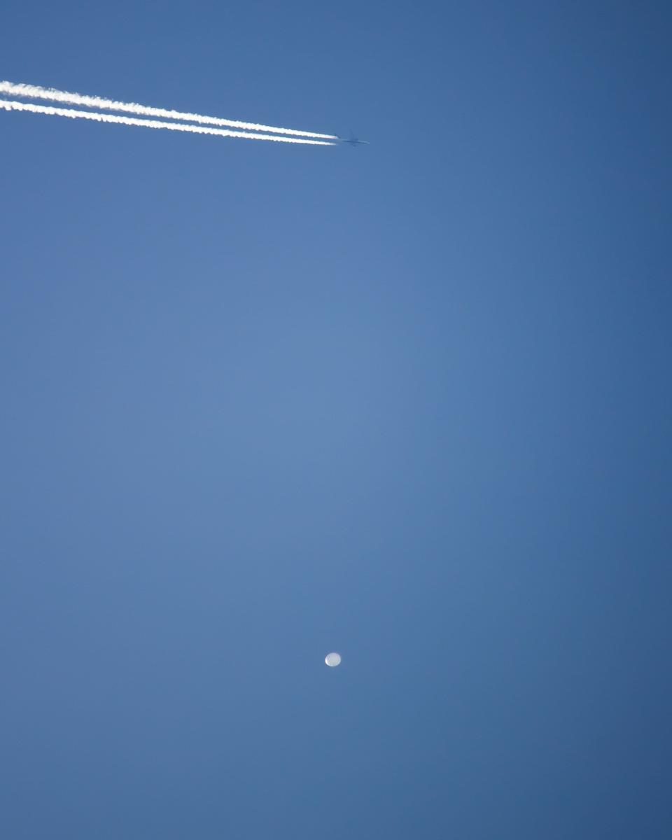 A balloon the U.S. Department of Defense is calling a "high-altitude surveillance balloon" drifts over Western North Carolina in this photo captured by UNC Asheville Meteorology major Evan Fisher and posted to his @EFisherWX Twitter page. The photo was taken in the Fairview area.