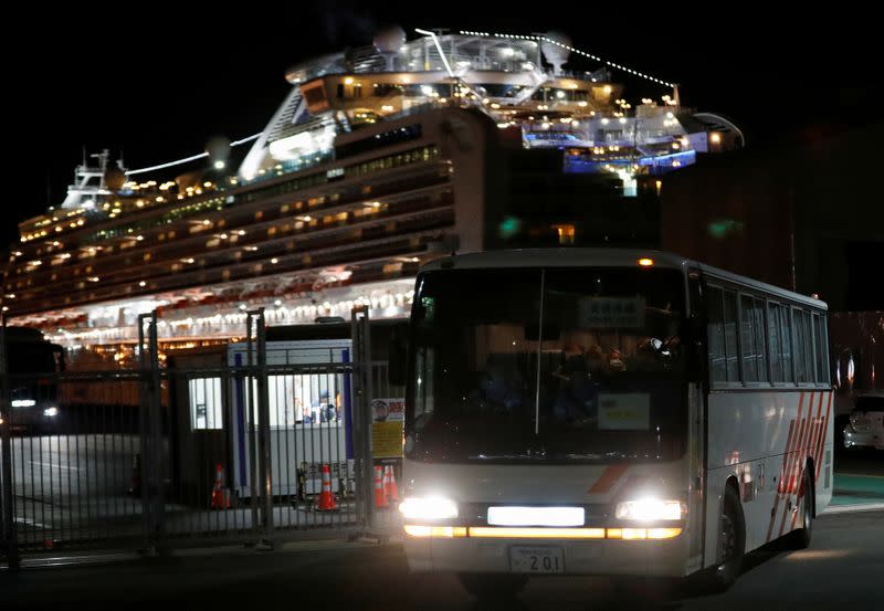 Passengers leave cruise ship Diamond Princess at Daikoku Pier Cruise Terminal in Yokohama