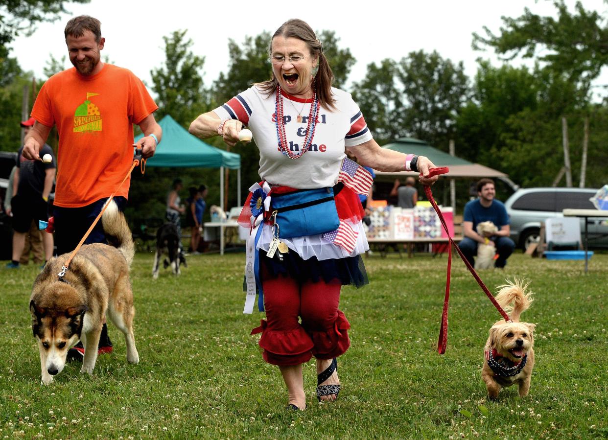 Rose Connolly of Chatham and her dog, Amber, a 5-year-old border terrier mix, participate in a egg spoon race Saturday at the Dogs at the Dock event at the Lake Springfield Prop Club.