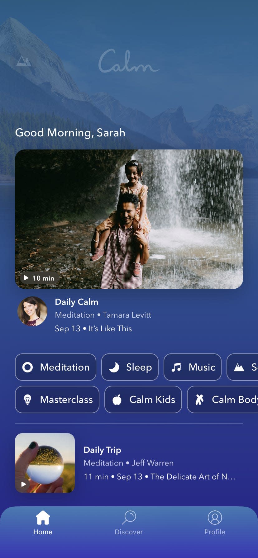 a blue screen and a thumbnail image for a session called "Daily Calm" in a screenshot of the meditation app Calm