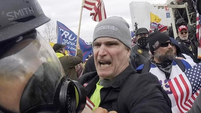 In this image from video, Alan William Byerly (center) attacks an Associated Press photographer during a riot at the U.S. Capitol in Washington, D.C. on Jan. 6, 2021. (Photo: Julio Cortez/AP, File)