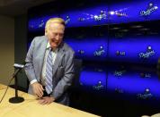 <p>Vin Scully, a Hall of Fame broadcaster who is in the final days of his 67-year career covering Los Angeles Dodgers baseball games, smiles as he leaves after talking with reporters at Dodger Stadium on Saturday, Sept. 24, 2016. (AP Photo/Reed Saxon) </p>