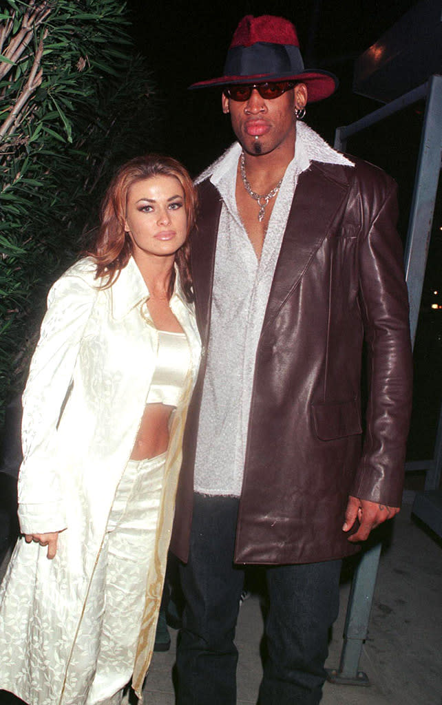 <b>Carmen Electra, Dennis Rodman</b><br> Model Carmen Electra and NBA star Dennis Rodman decided to tie the knot somewhere where their eccentric styles would blend in with the scenery ... so they chose Vegas, naturally. The couple tied the knot in November 1998 at the Little Chapel of the Flowers, but soon learned marriage wasn't as rosy as they thought. Electra filed for an annulment nine days later. "It's easy to get caught up in a moment," Electra told <a href=" http://www.people.com/people/carmen_electra/biography/0,,,00.html" rel="nofollow noopener" target="_blank" data-ylk="slk:People;elm:context_link;itc:0;sec:content-canvas" class="link ">People</a> afterwards. "You think it's romantic, but then you realize, 'God, we did it in Vegas?' It's like getting a cheeseburger at a fast-food restaurant."