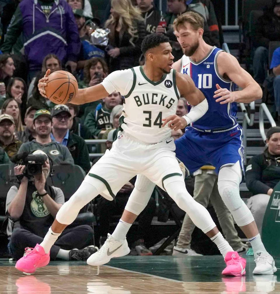 Milwaukee Bucks forward Giannis Antetokounmpo (34) seen on offense as Sacramento Kings forward Domantas Sabonis (10) plays defense during the first half of their game Sunday, Jan. 14, 2024, at Fiserv Forum in Milwaukee. Ebony Cox / Milwaukee Journal Sentinel