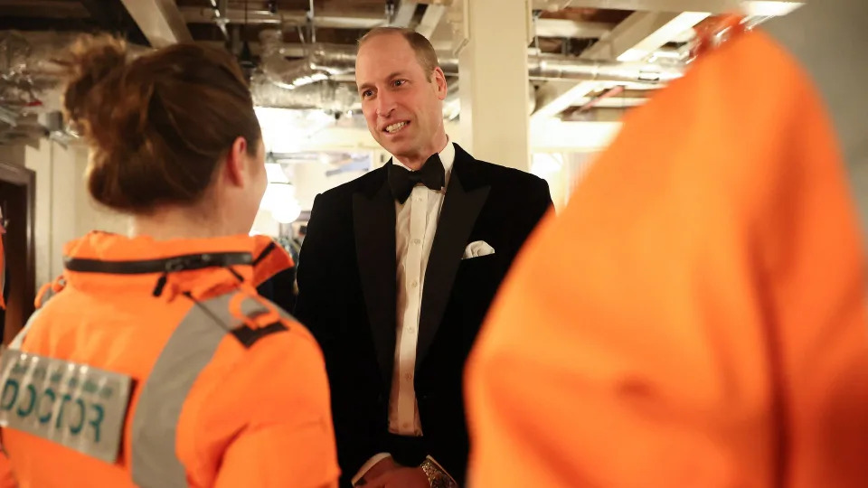 Britain's Prince William, Prince of Wales talks with Air Ambulance pilots, doctors and paramedics 