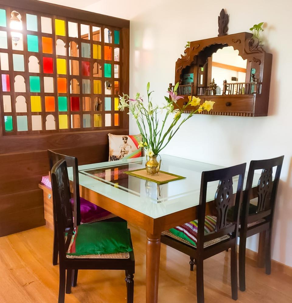 The dining area is cosy with varied shades of wood. Bhakti draws attention to the vintage chairs that lend character to this section.