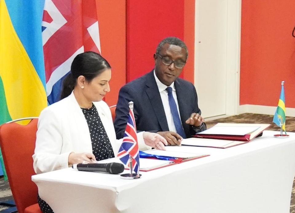 Home Secretary Priti Patel and Rwandan minister for foreign affairs and international co-operation, Vincent Biruta, sign a migration and economic development partnership (Flora Thompson/PA) (PA Wire)