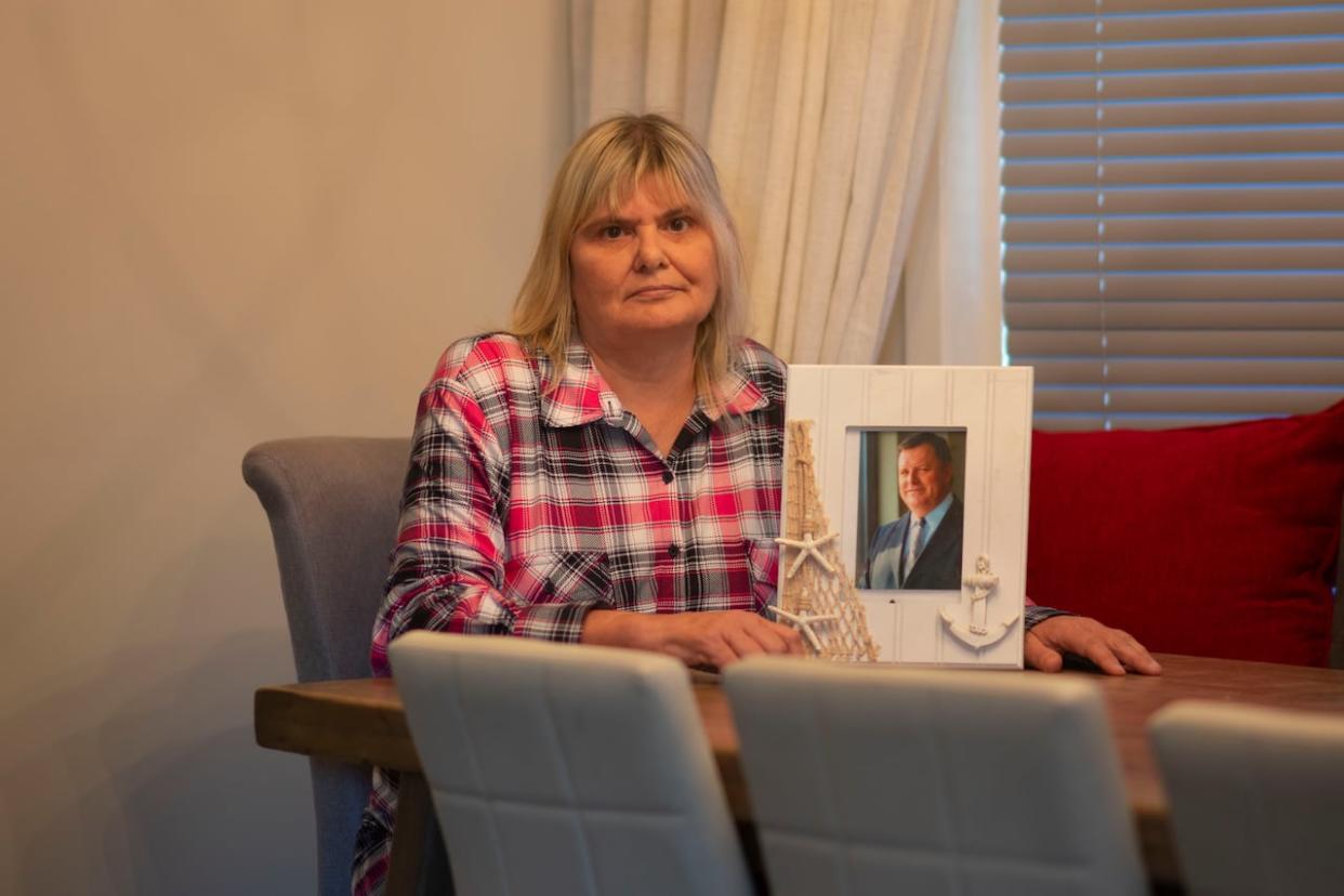 Patricia Mason-Levasseur with a photograph of Patrick Keith, who drowned at Crystal Beach on July 22, 2016.  (Bobby Hristova/CBC - image credit)