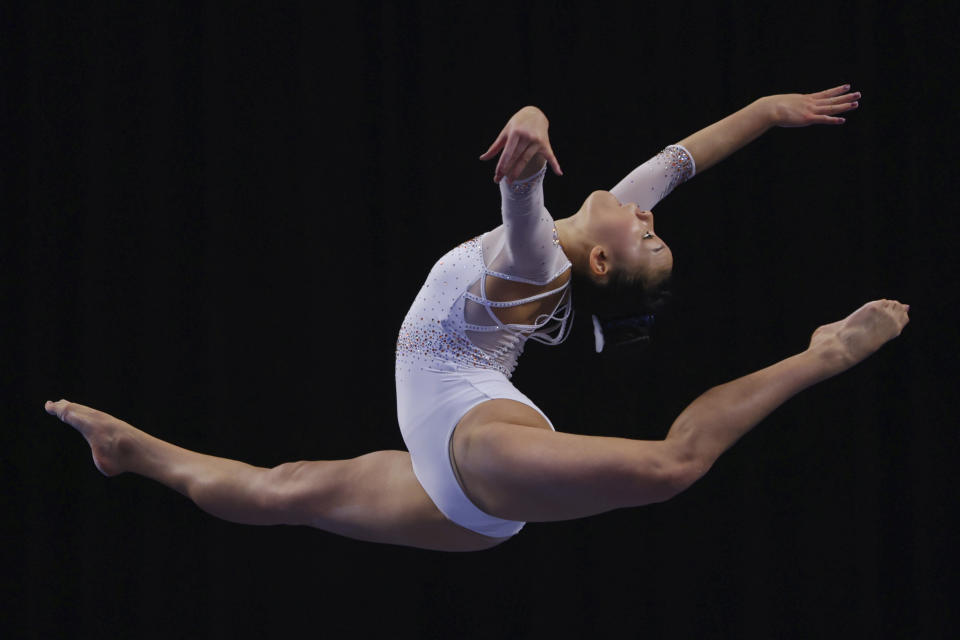 Florida's Leanne Wong competes on the balance beam during the NCAA college women's gymnastics championships, Saturday, April 16, 2022, in Fort Worth, Texas. (AP Photo/Gareth Patterson)