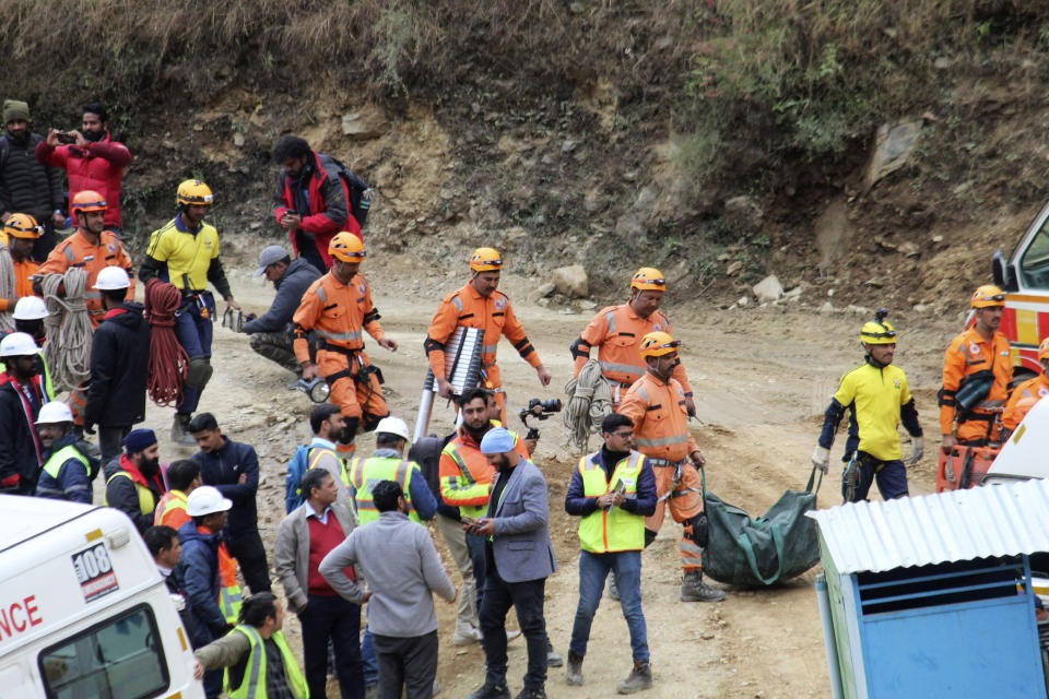 Rescuers work at the site of an under-construction road tunnel that collapsed in Silkyara in the northern Indian state of Uttarakhand, India, Tuesday, Nov. 28, 2023. Officials in India said Tuesday they were on the verge of rescuing the 41 construction workers trapped in a collapsed mountain tunnel for over two weeks in the country's north, after rescuers drilled their way through debris to reach them. (AP Photo)
