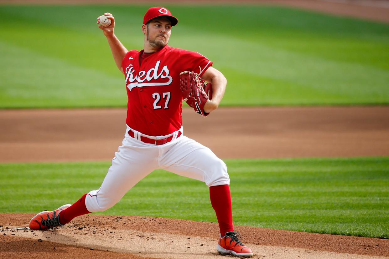 Reds starting pitcher Trevor Bauer (27) delivers the ball in the day baseball game against Pittsburgh Pirates on Monday, Sept. 14, 2020, at Great American Ball Park.