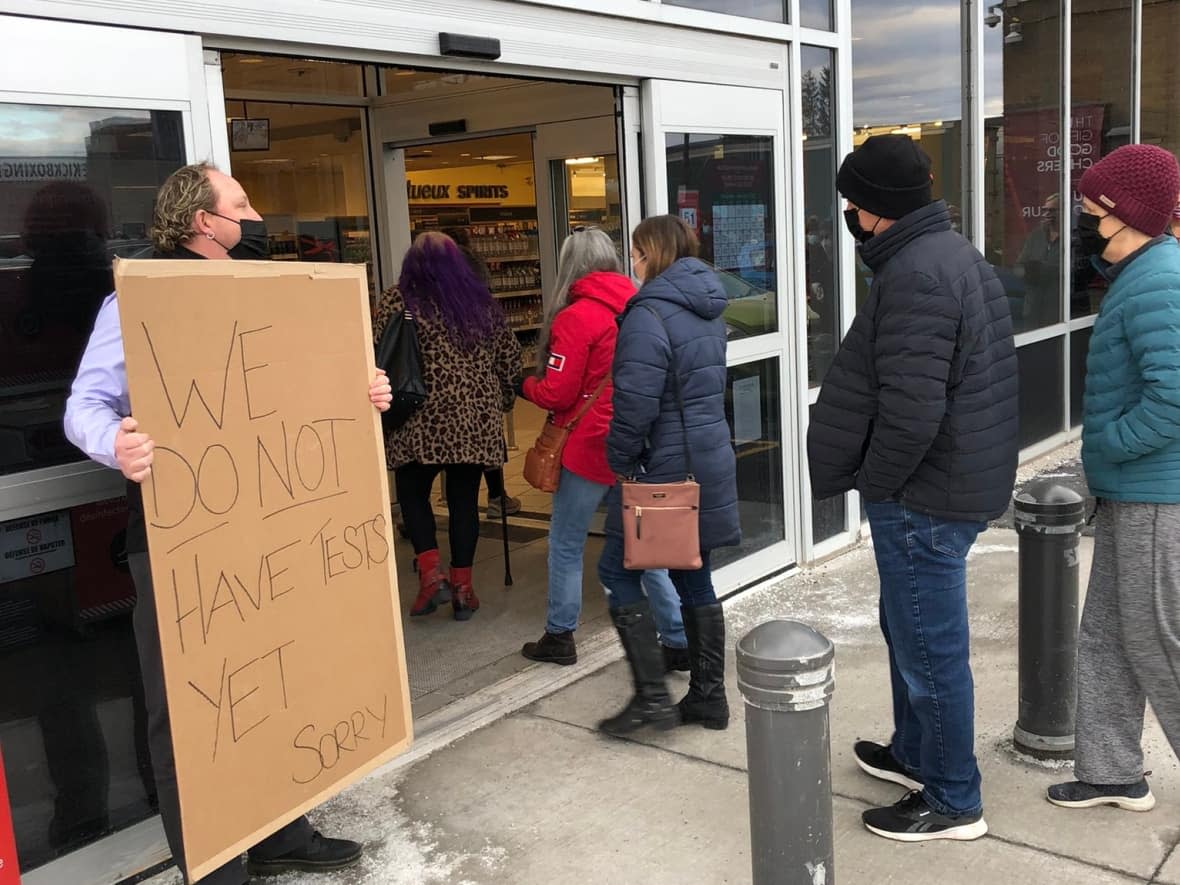 'There were audible groans of disappointment when the guy with the sign came out, said David Brennan, who lined up for a rapid test kit outside the LCBO location at Bank Street and Walkley Road. (David Brennan/Twitter - image credit)