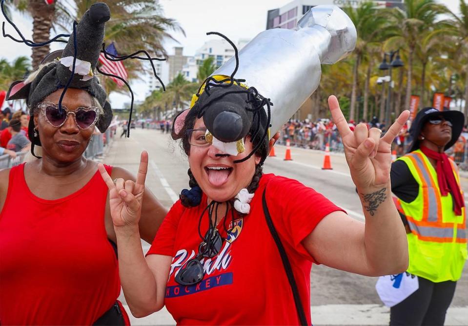 Fort Lauderdale resident Yvette Queda, 59, left, and Roxanne Sshnider, 52, of West Palm Beach, right, join Panthers fan on the parade route on  A1A and Las Olas to watch celebration of the Stanley Cup win in Fort Lauderdale on Sunday, June 30, 2024.