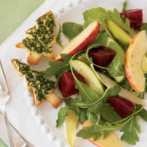 <p>Fresh and full of crunch, this salad tosses baby arugula and Belgian endive together with red beets and Royal Gala and Granny Smith apples in a syrup-tinged olive oil–and-vinegar dressing.</p><p><strong><a href="https://www.countryliving.com/food-drinks/recipes/a30957/beet-apple-salad-maple-dressing-121276/" rel="nofollow noopener" target="_blank" data-ylk="slk:Get the recipe;elm:context_link;itc:0;sec:content-canvas" class="link ">Get the recipe</a>.</strong> </p>