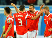 <p>Artem Dzyuba celebrates scoring Russia’s third goal with team mates </p>