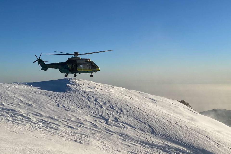 <p>Special Enforcement Bureau - LASD/ X</p> Photo of helicopter near the top of Mount Baldy