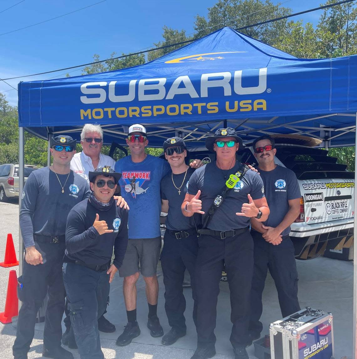 Travis Pastrana, third from left in the back row, poses with Marathon Fire Rescue staff including Chief John Johnson and Deputy Chief Cameron Bucek, who were on hand for the July 11,2022, stunt jump at Boot Key Bridge.
