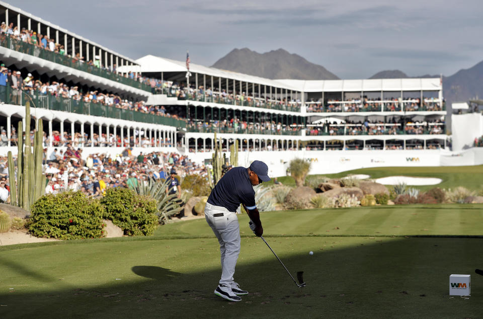 Harold Varner III hits from the 16th tee during the first round of the Phoenix Open PGA golf tournament, Thursday, Jan. 31, 2019, in Scottsdale, Ariz. (AP Photo/Matt York)