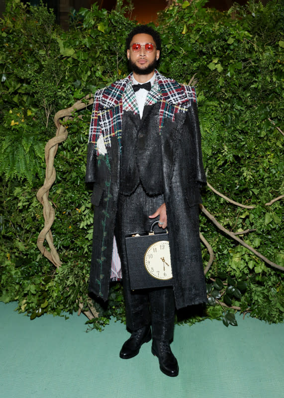 <p>Cindy Ord/MG24/Getty Images</p><p>The NBA star rocked a plaid suit and jacket and carried a briefcase emblazoned with a clock on the side. </p>