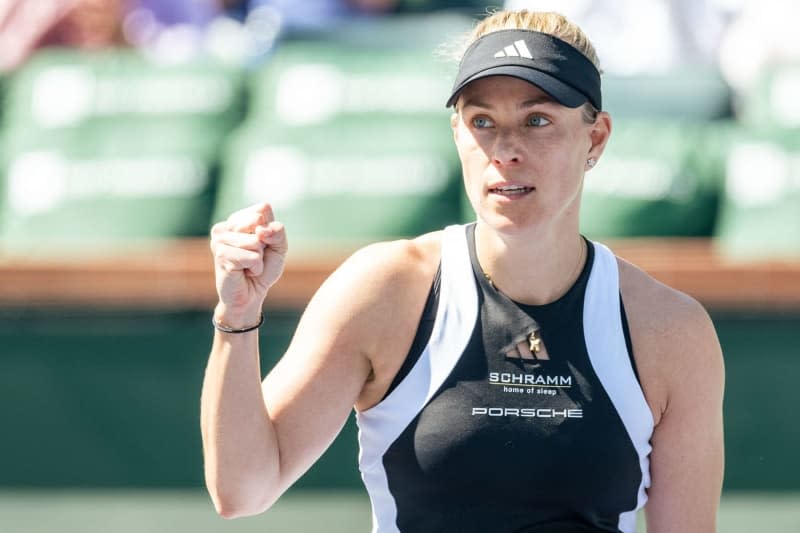 German tennis player Angelique Kerber celebrates defeating Croatian Petra Martic during their women's singles first round match of the Indian Wells Open tennis tournament. Maximilian Haupt/dpa